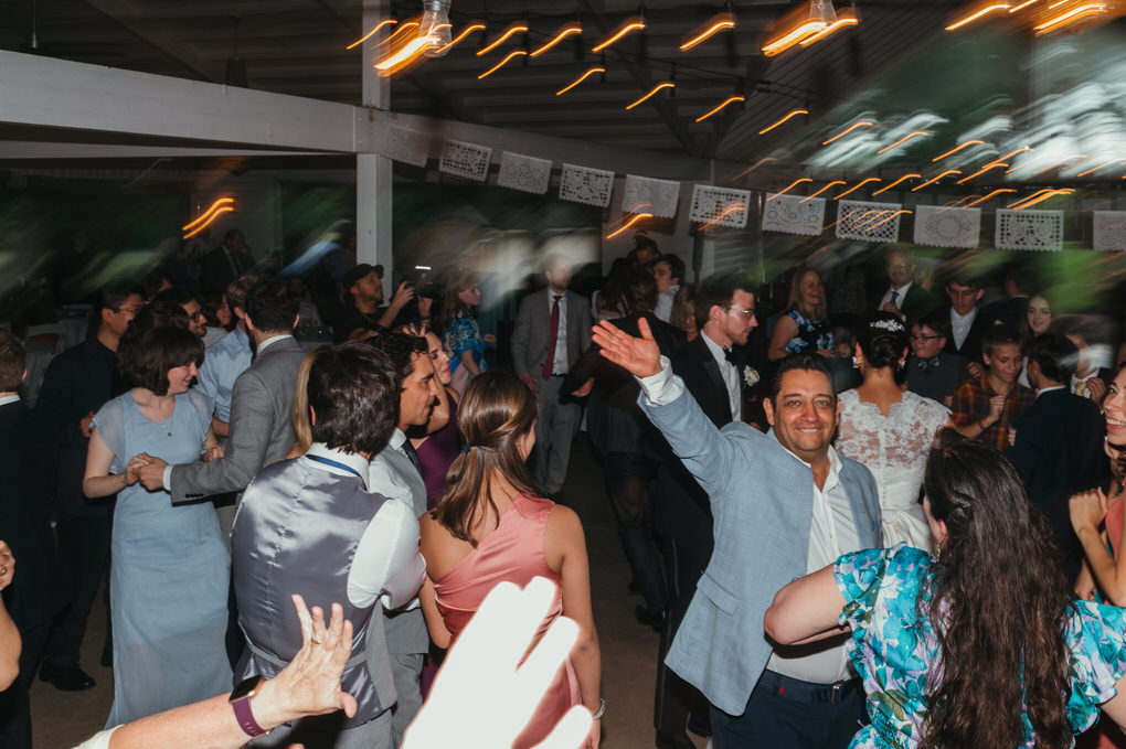 guests dancing during reception of mexican wedding in austin texas